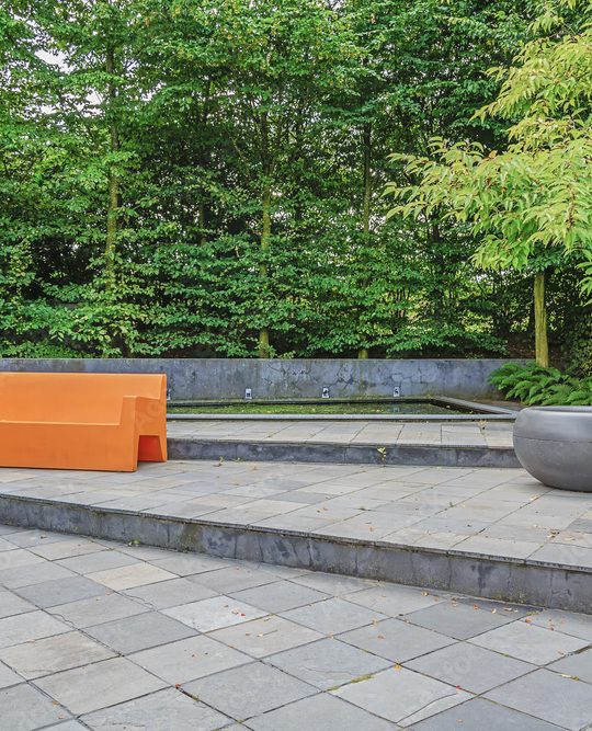 Orange sofa in the inner courtyard garden