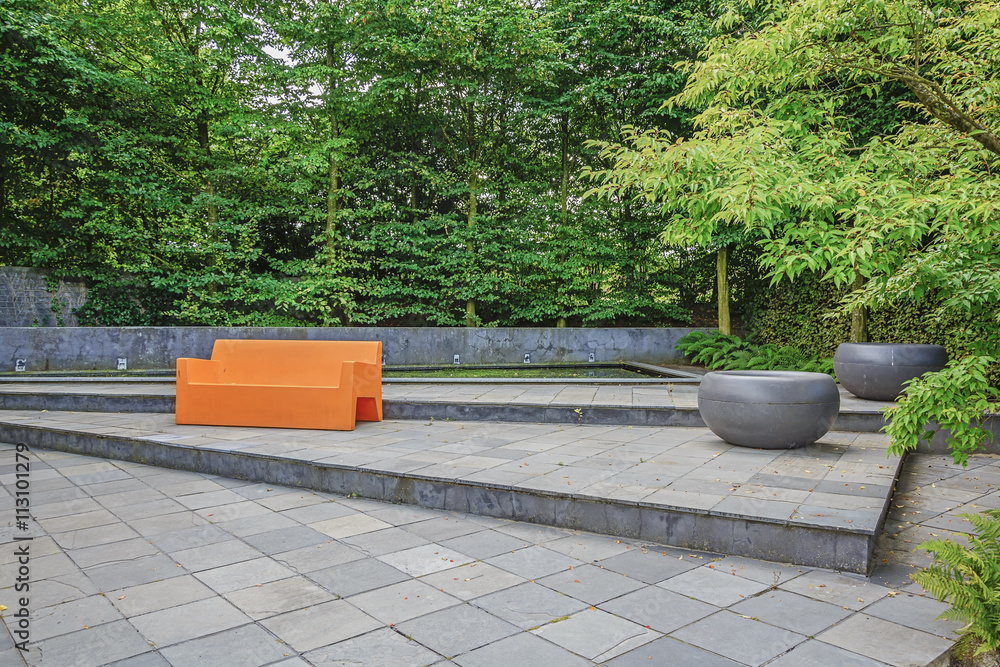 Orange sofa in the inner courtyard garden